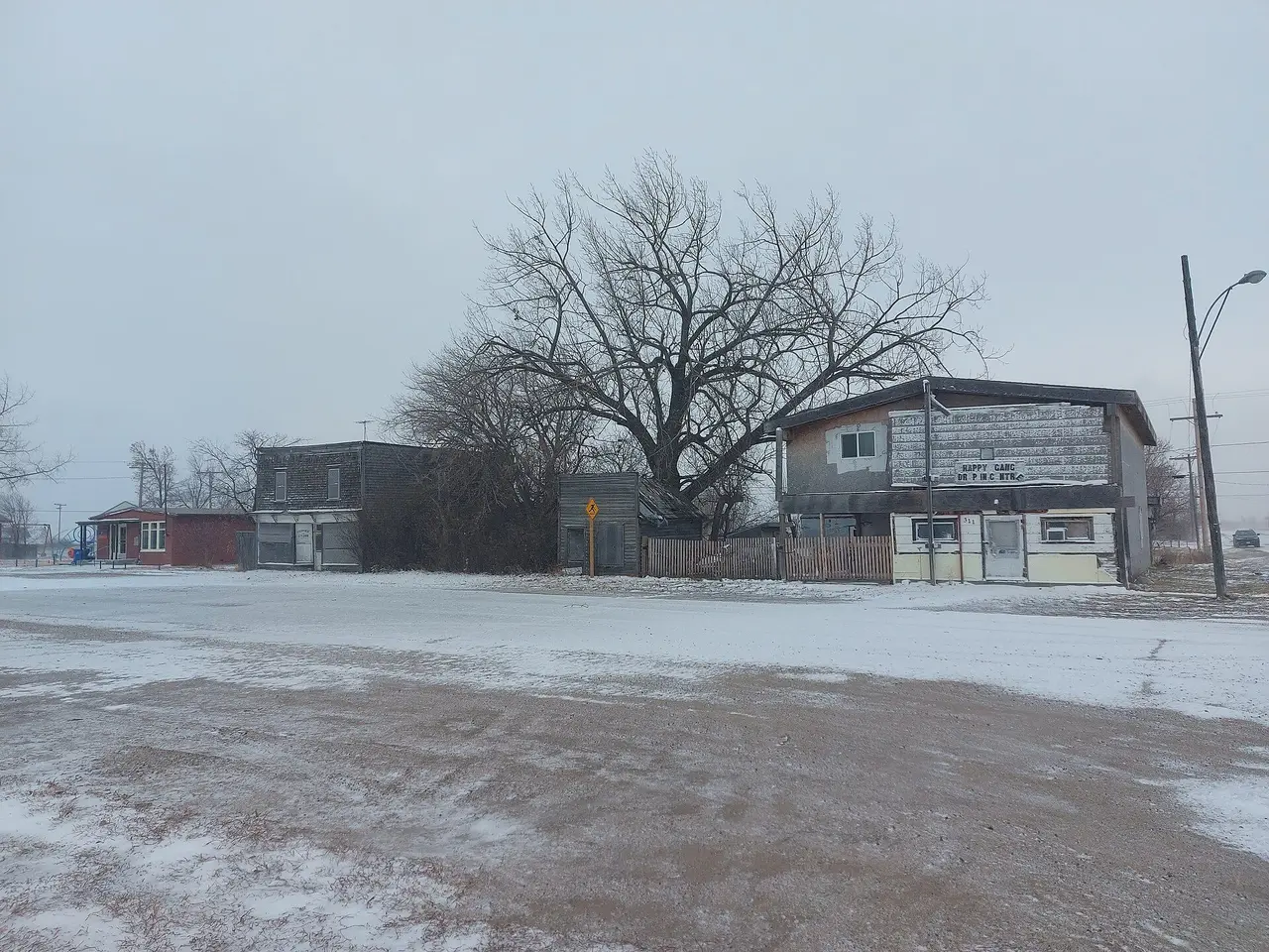 Old buildings on a snowy downtown street, 2022